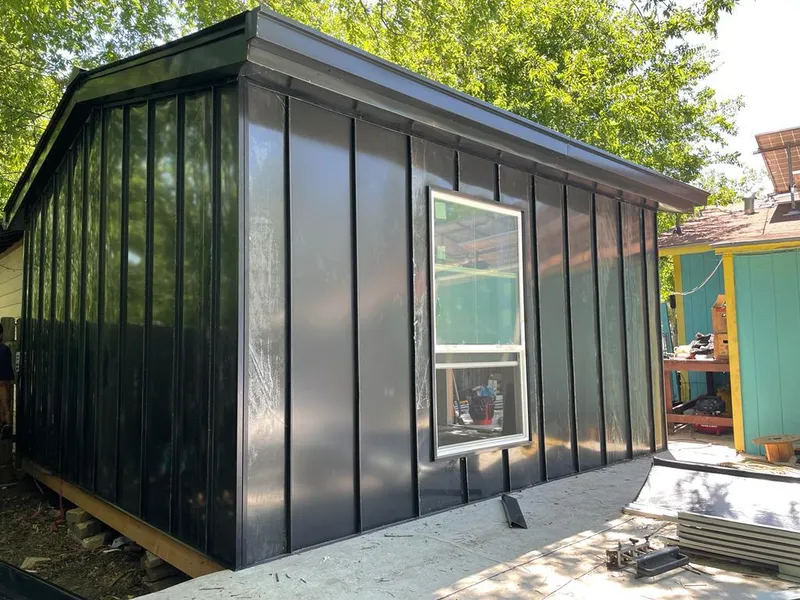 Black standing seam metal wall panels for Metal Roof Installation in St. James