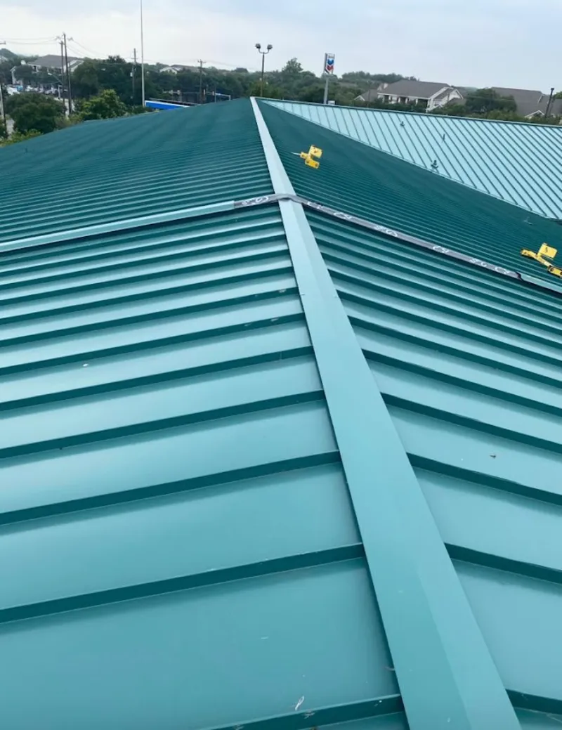 Green commercial metal roof ridge and valley for Metal Roof Repair in St. James