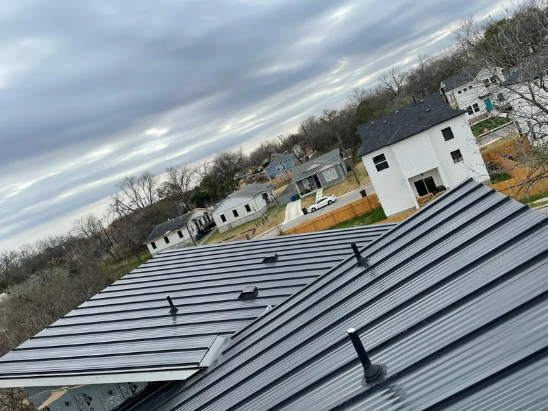 Standing seam metal roof panels with vents for Skylight Repair in St. James